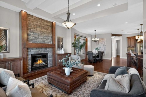 125 Artesia Gate, Heritage Pointe, AB - Indoor Photo Showing Living Room With Fireplace
