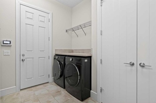 125 Artesia Gate, Heritage Pointe, AB - Indoor Photo Showing Laundry Room