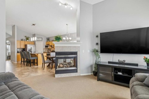 328 Cove Road, Chestermere, AB - Indoor Photo Showing Living Room With Fireplace