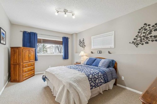 328 Cove Road, Chestermere, AB - Indoor Photo Showing Bedroom