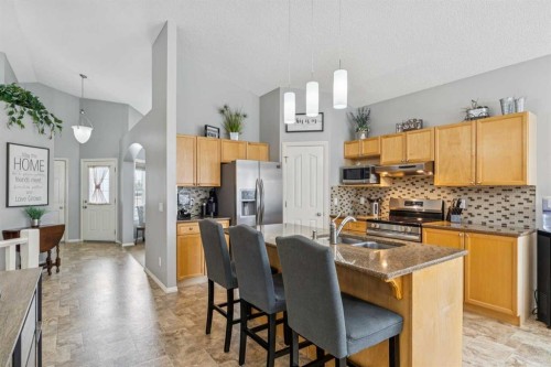 328 Cove Road, Chestermere, AB - Indoor Photo Showing Kitchen With Double Sink With Upgraded Kitchen