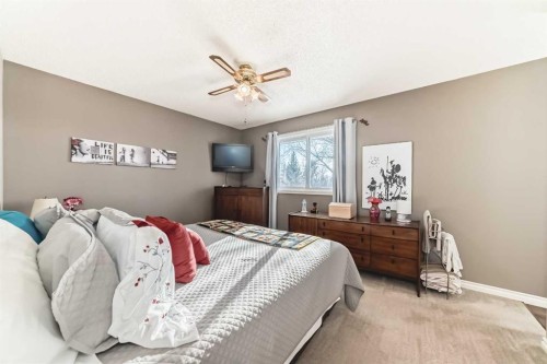 8 Meadow Place Se, Airdrie, AB - Indoor Photo Showing Bedroom