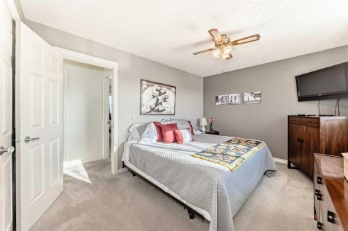 8 Meadow Place Se, Airdrie, AB - Indoor Photo Showing Bedroom