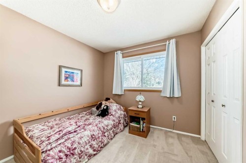 8 Meadow Place Se, Airdrie, AB - Indoor Photo Showing Bedroom