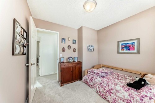 8 Meadow Place Se, Airdrie, AB - Indoor Photo Showing Bedroom