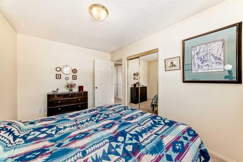 8 Meadow Place Se, Airdrie, AB - Indoor Photo Showing Bedroom