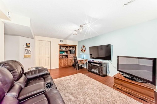 8 Meadow Place Se, Airdrie, AB - Indoor Photo Showing Living Room