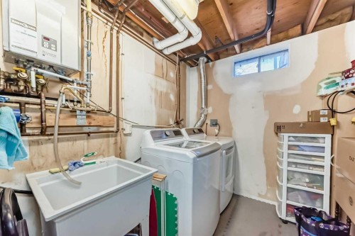 8 Meadow Place Se, Airdrie, AB - Indoor Photo Showing Laundry Room