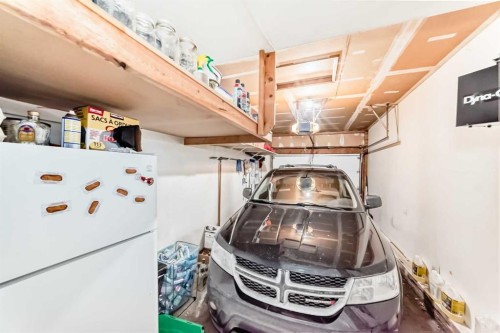 8 Meadow Place Se, Airdrie, AB - Indoor Photo Showing Garage