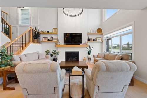224 South Shore View, Chestermere, AB - Indoor Photo Showing Living Room With Fireplace
