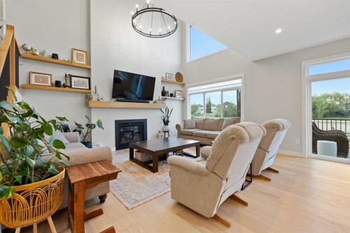 224 South Shore View, Chestermere, AB - Indoor Photo Showing Living Room With Fireplace