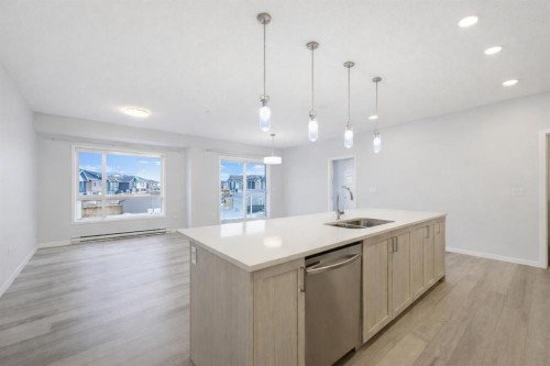3205-220 Seton Grove Se, Calgary, AB - Indoor Photo Showing Kitchen With Double Sink With Upgraded Kitchen