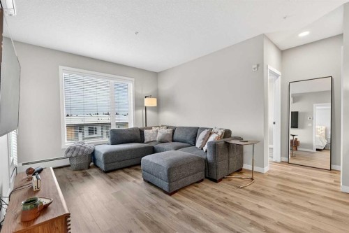 401-150 Shawnee Square Sw, Calgary, AB - Indoor Photo Showing Living Room