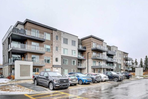 401-150 Shawnee Square Sw, Calgary, AB - Outdoor With Balcony With Facade