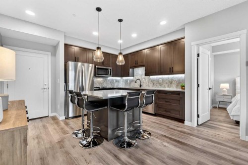 401-150 Shawnee Square Sw, Calgary, AB - Indoor Photo Showing Kitchen With Upgraded Kitchen
