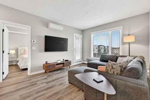 401-150 Shawnee Square Sw, Calgary, AB - Indoor Photo Showing Living Room