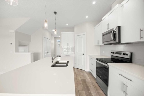 507 Lucas Boulevard Nw, Calgary, AB - Indoor Photo Showing Kitchen With Stainless Steel Kitchen With Double Sink With Upgraded Kitchen