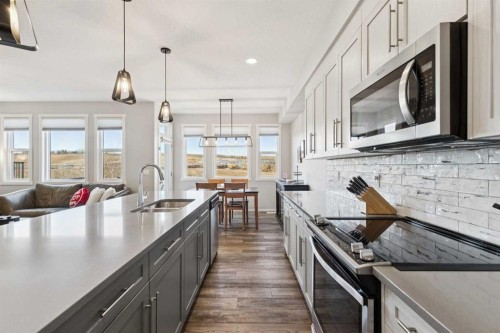 57 Crestridge Bay Sw, Calgary, AB - Indoor Photo Showing Kitchen With Double Sink With Upgraded Kitchen