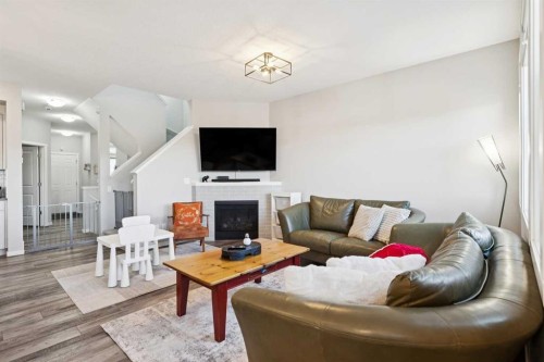 57 Crestridge Bay Sw, Calgary, AB - Indoor Photo Showing Living Room With Fireplace