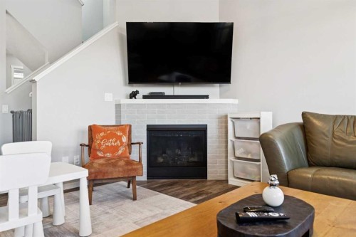 57 Crestridge Bay Sw, Calgary, AB - Indoor Photo Showing Living Room With Fireplace