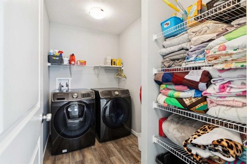 57 Crestridge Bay Sw, Calgary, AB - Indoor Photo Showing Laundry Room
