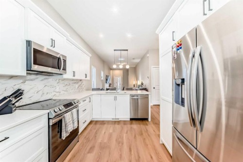 146 Highview Gate Se, Airdrie, AB - Indoor Photo Showing Kitchen With Stainless Steel Kitchen With Upgraded Kitchen