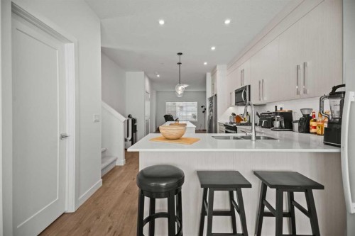 7581 202 Avenue Se, Calgary, AB - Indoor Photo Showing Kitchen With Double Sink With Upgraded Kitchen