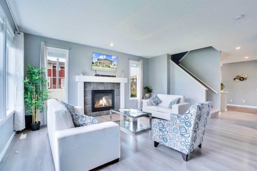 100 Redstone Parade Ne, Calgary, AB - Indoor Photo Showing Living Room With Fireplace