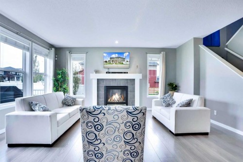 100 Redstone Parade Ne, Calgary, AB - Indoor Photo Showing Living Room With Fireplace