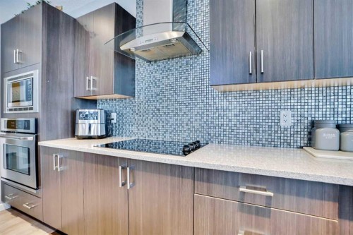 100 Redstone Parade Ne, Calgary, AB - Indoor Photo Showing Kitchen With Upgraded Kitchen