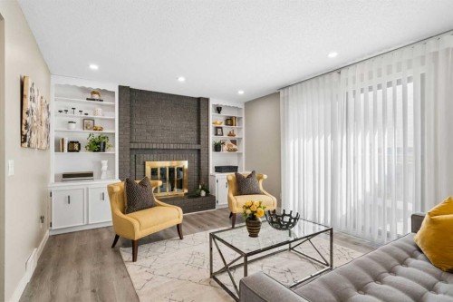 220 Macewan Glen Place Nw, Calgary, AB - Indoor Photo Showing Living Room With Fireplace