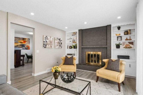 220 Macewan Glen Place Nw, Calgary, AB - Indoor Photo Showing Living Room With Fireplace