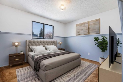 21 Mountain Circle Se, Airdrie, AB - Indoor Photo Showing Bedroom