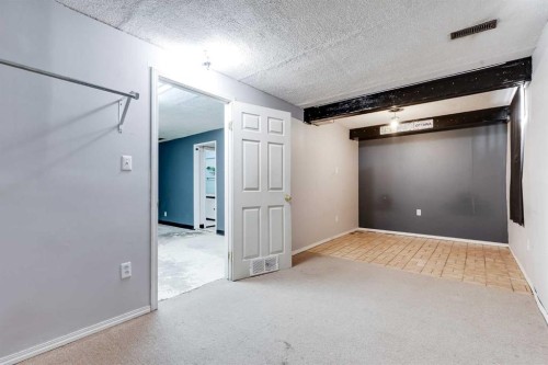 21 Mountain Circle Se, Airdrie, AB - Indoor Photo Showing Other Room