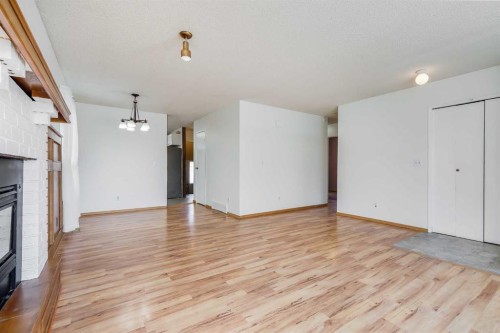 21 Mountain Circle Se, Airdrie, AB - Indoor With Fireplace