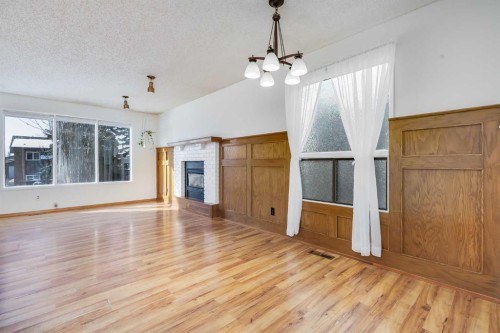 21 Mountain Circle Se, Airdrie, AB - Indoor With Fireplace