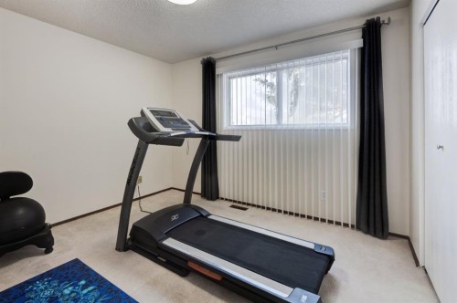 4 Cedargrove Way Sw, Calgary, AB - Indoor Photo Showing Gym Room