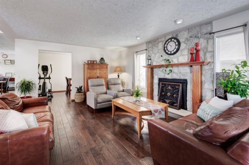 4 Cedargrove Way Sw, Calgary, AB - Indoor Photo Showing Living Room With Fireplace