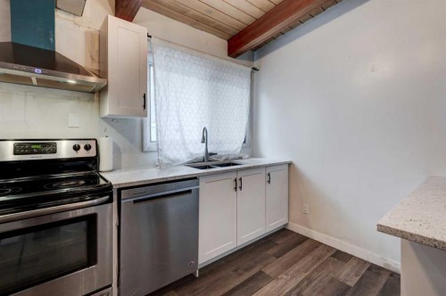 717 67 Avenue Sw, Calgary, AB - Indoor Photo Showing Kitchen With Double Sink