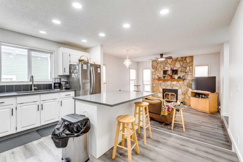 133 6 Avenue Se, Three Hills, AB - Indoor Photo Showing Kitchen With Fireplace
