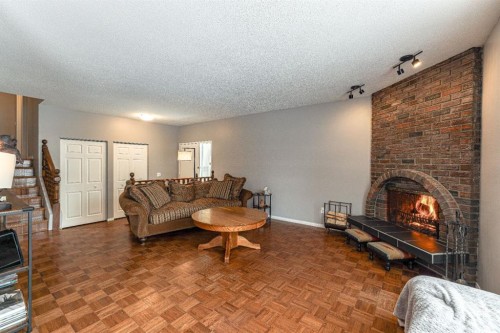 824 Whitemont Drive Ne, Calgary, AB - Indoor Photo Showing Living Room With Fireplace
