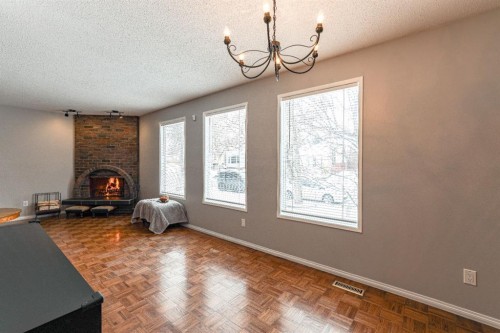 824 Whitemont Drive Ne, Calgary, AB - Indoor Photo Showing Other Room With Fireplace