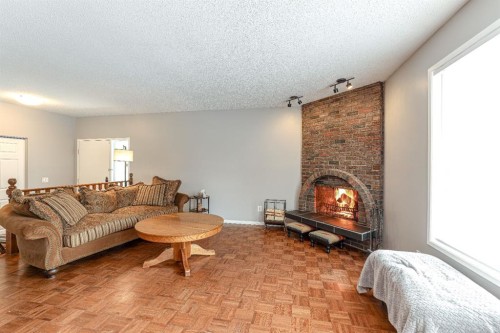 824 Whitemont Drive Ne, Calgary, AB - Indoor Photo Showing Living Room With Fireplace