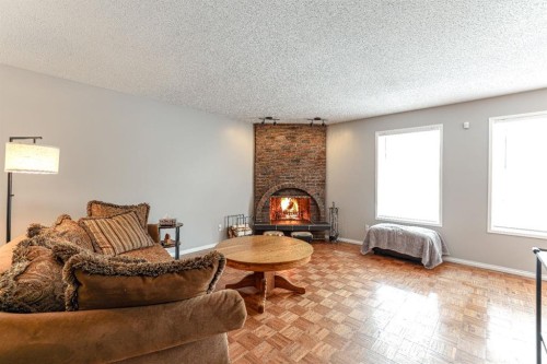 824 Whitemont Drive Ne, Calgary, AB - Indoor Photo Showing Living Room With Fireplace