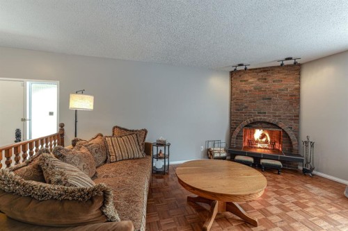 824 Whitemont Drive Ne, Calgary, AB - Indoor Photo Showing Living Room With Fireplace
