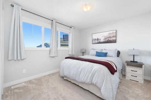 141 Boulder Creek Place, Langdon, AB - Indoor Photo Showing Bedroom