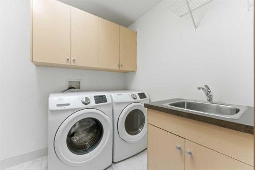 8 Coulee Park Sw, Calgary, AB - Indoor Photo Showing Laundry Room