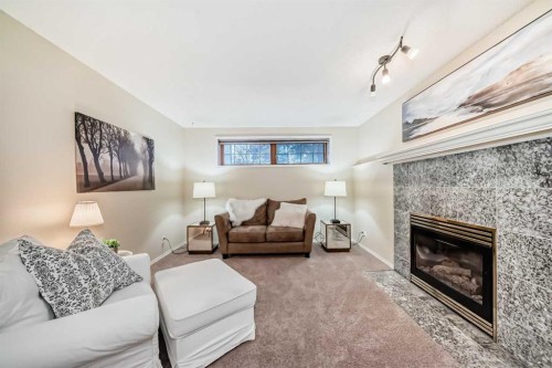 173 Shannon Hill Sw, Calgary, AB - Indoor Photo Showing Living Room With Fireplace