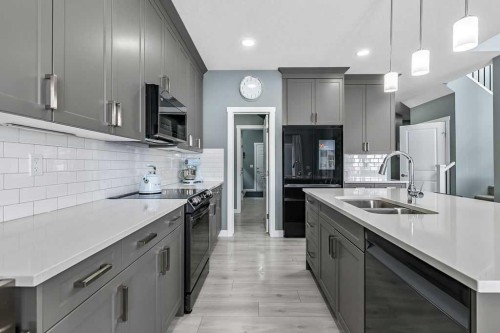 5 Birch Glen, Okotoks, AB - Indoor Photo Showing Kitchen With Double Sink With Upgraded Kitchen