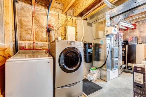 60 Erin Meadow Way Se, Calgary, AB - Indoor Photo Showing Laundry Room
